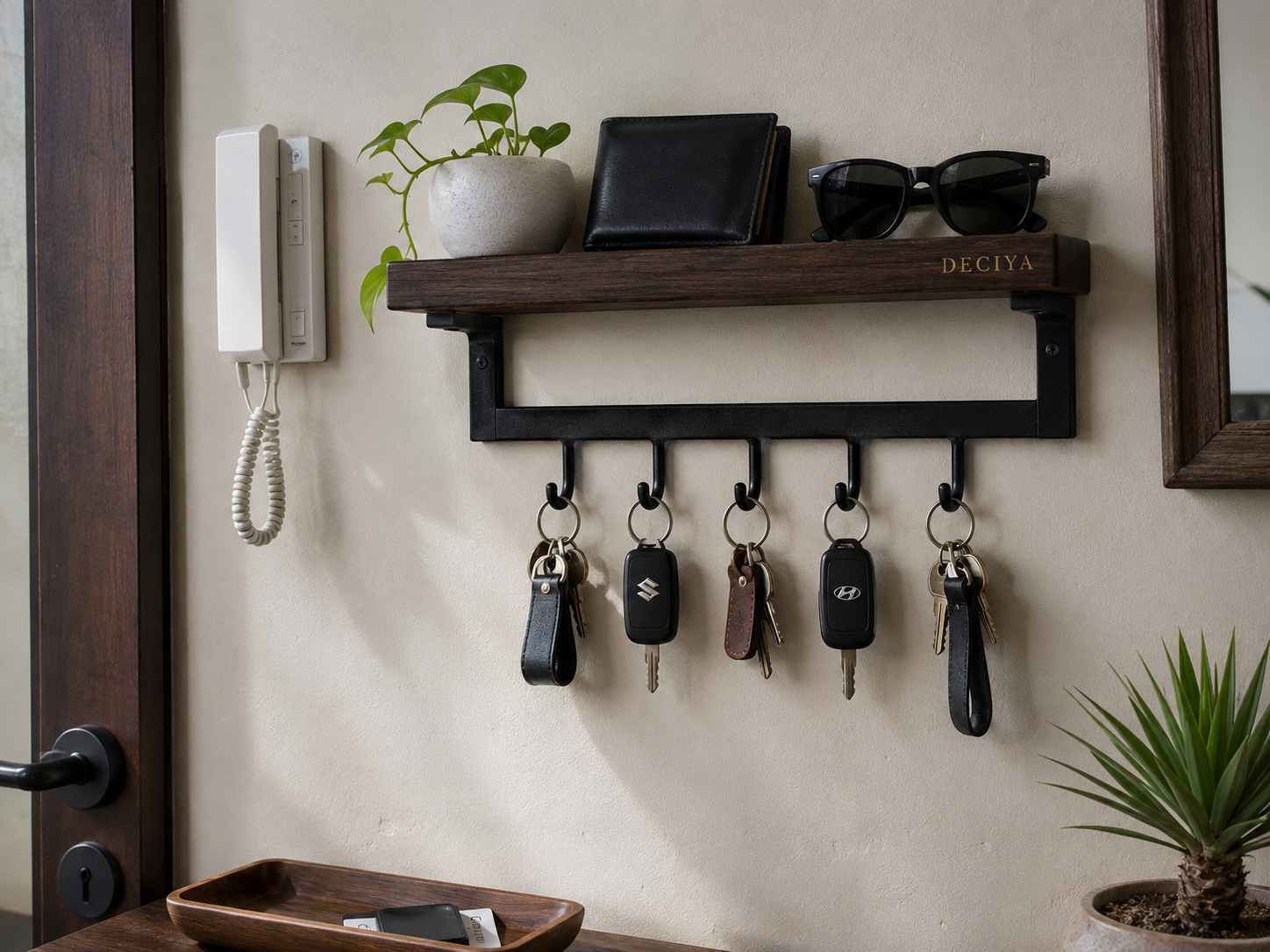 KeyDock mounted on entryway wall — car keys, wallet, sunglasses